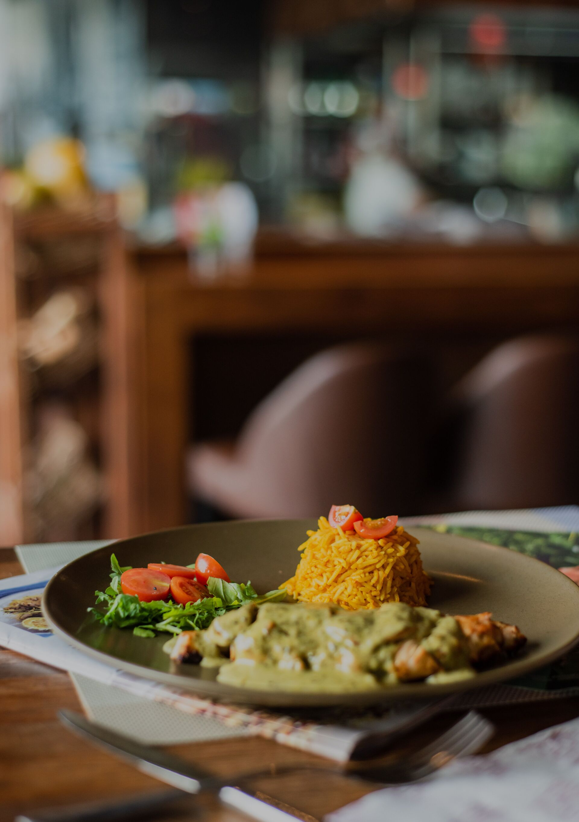 A close-up of a dinner served on a brown plate - restaurant dish concept