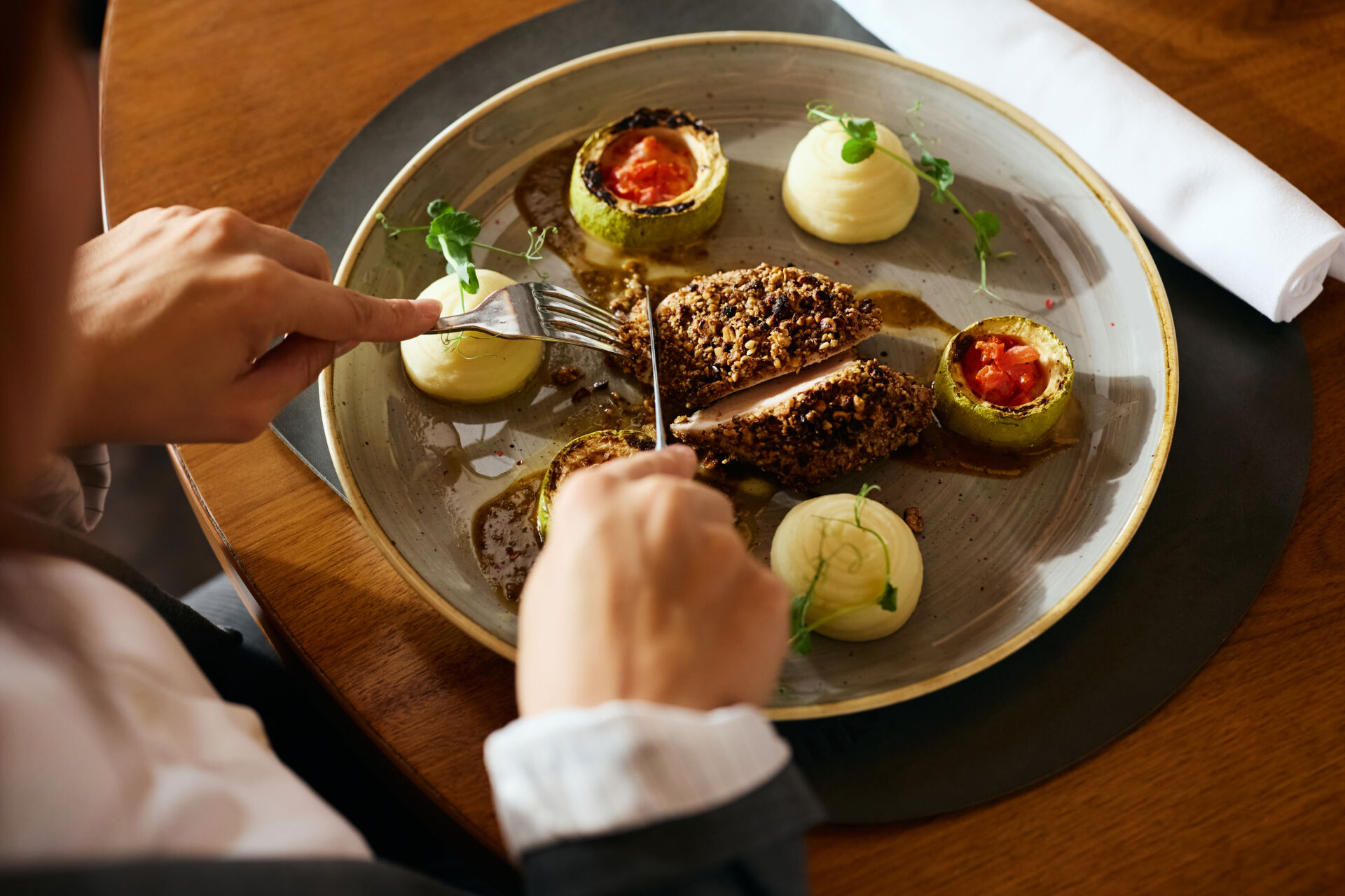 Close up of businesswoman eating in a restaurant during lunch time.