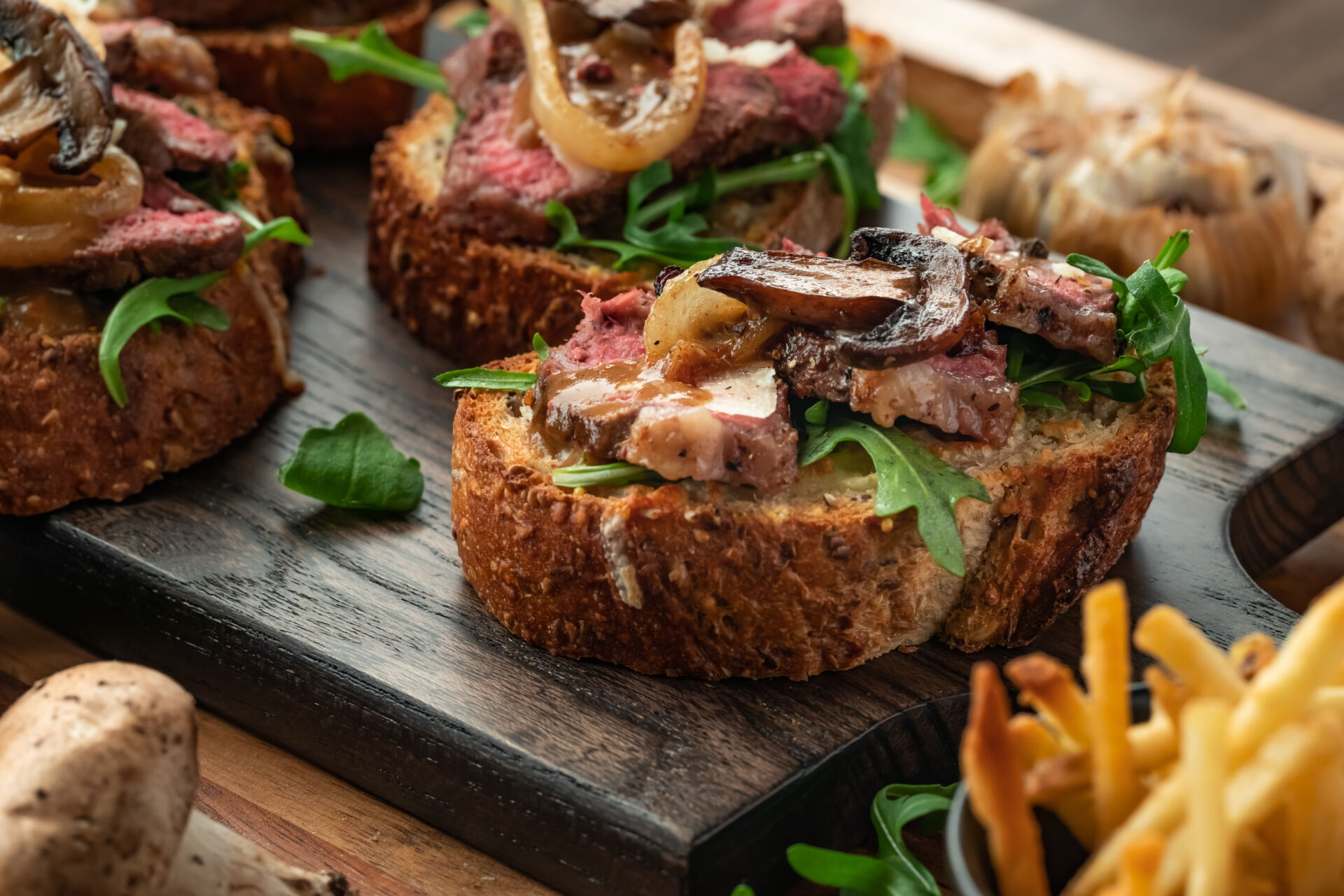 close up view of an open faced steak sandwich