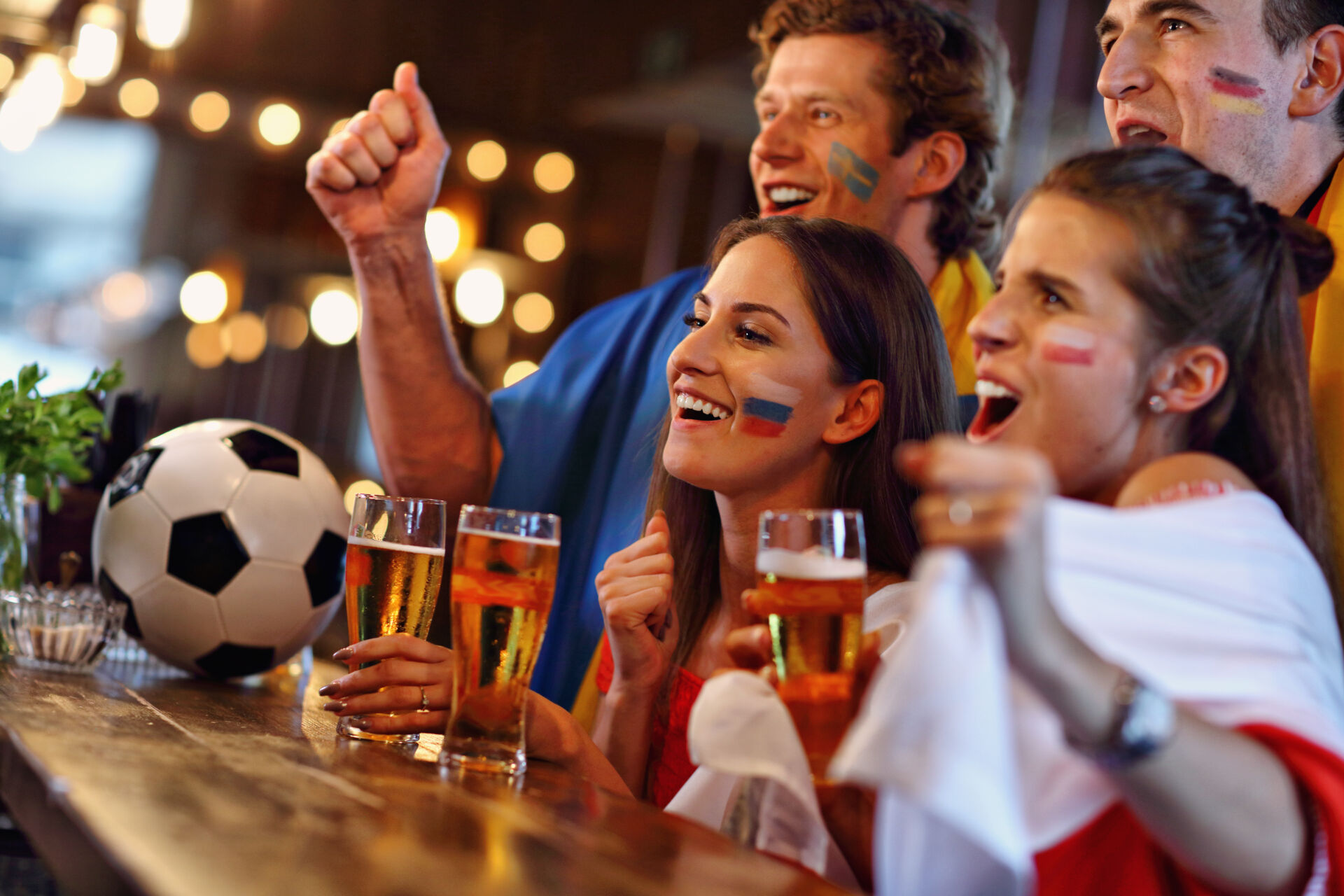 Mixture of nationalities watching football in gastro pub in Bridge