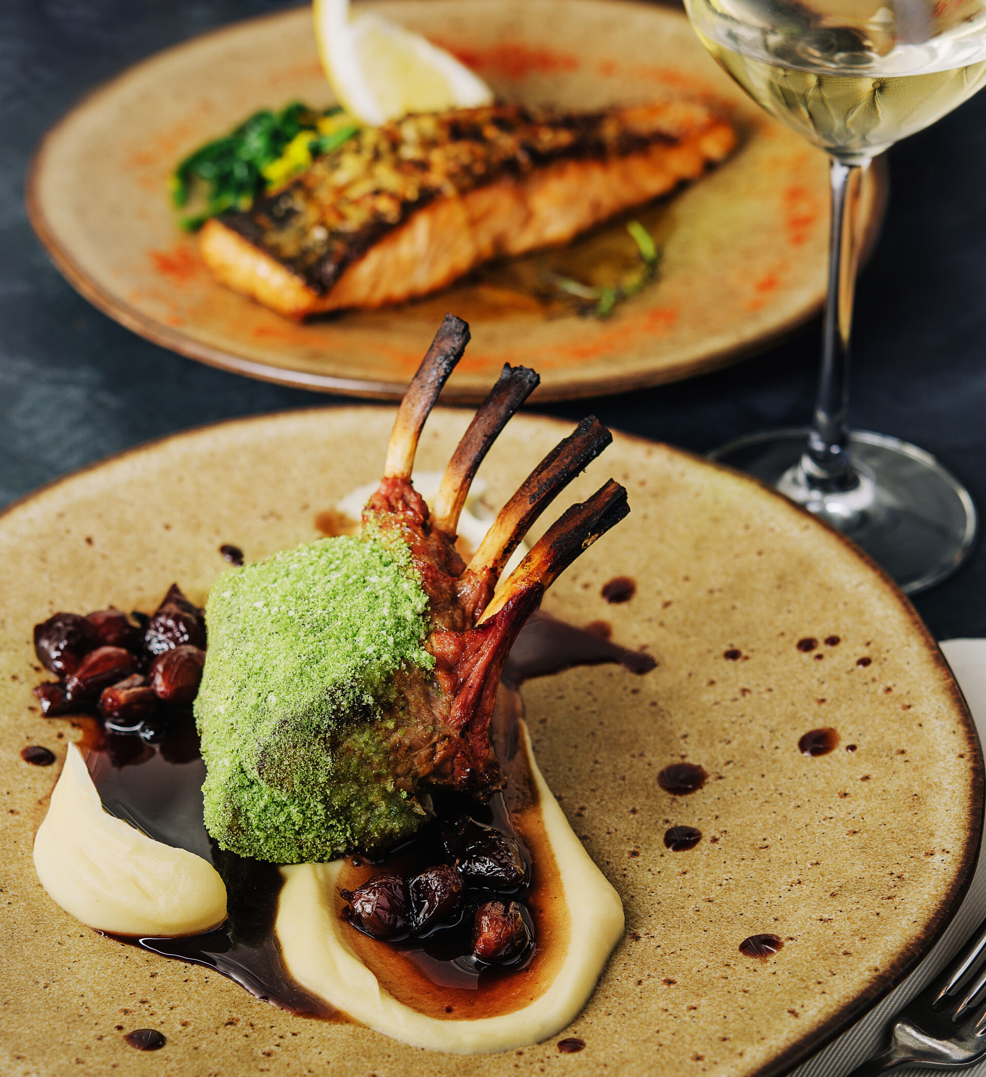 Rack of lamb in breaded pistachio nuts, dark sauce and herbs