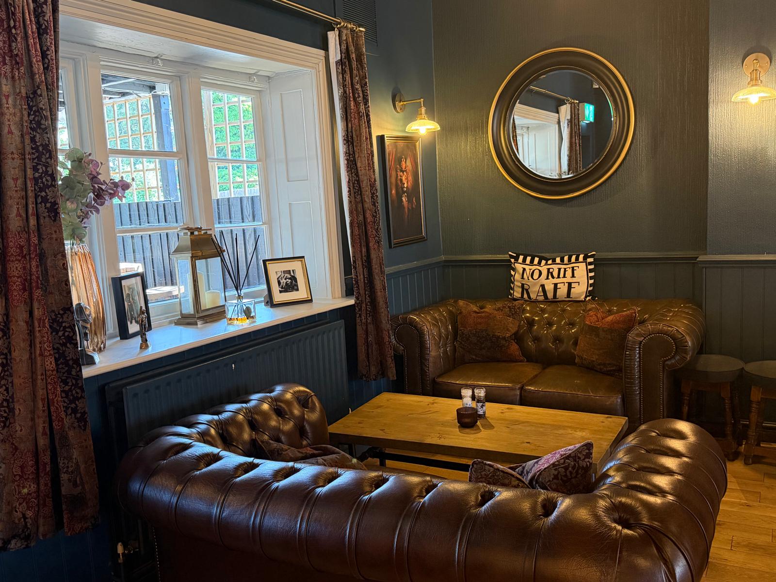 The Red Lion Inn Bridge inside lounging area leather sofa setties