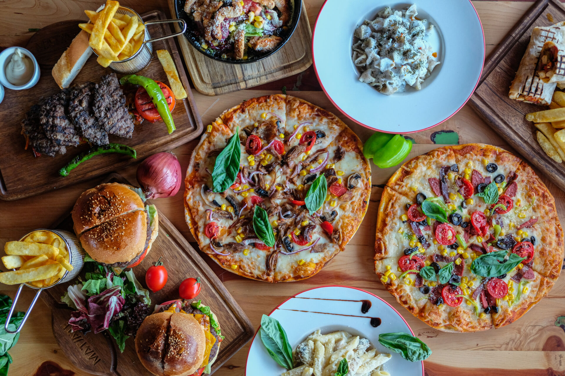 Pizza and various meat dishes and Turkish pastries